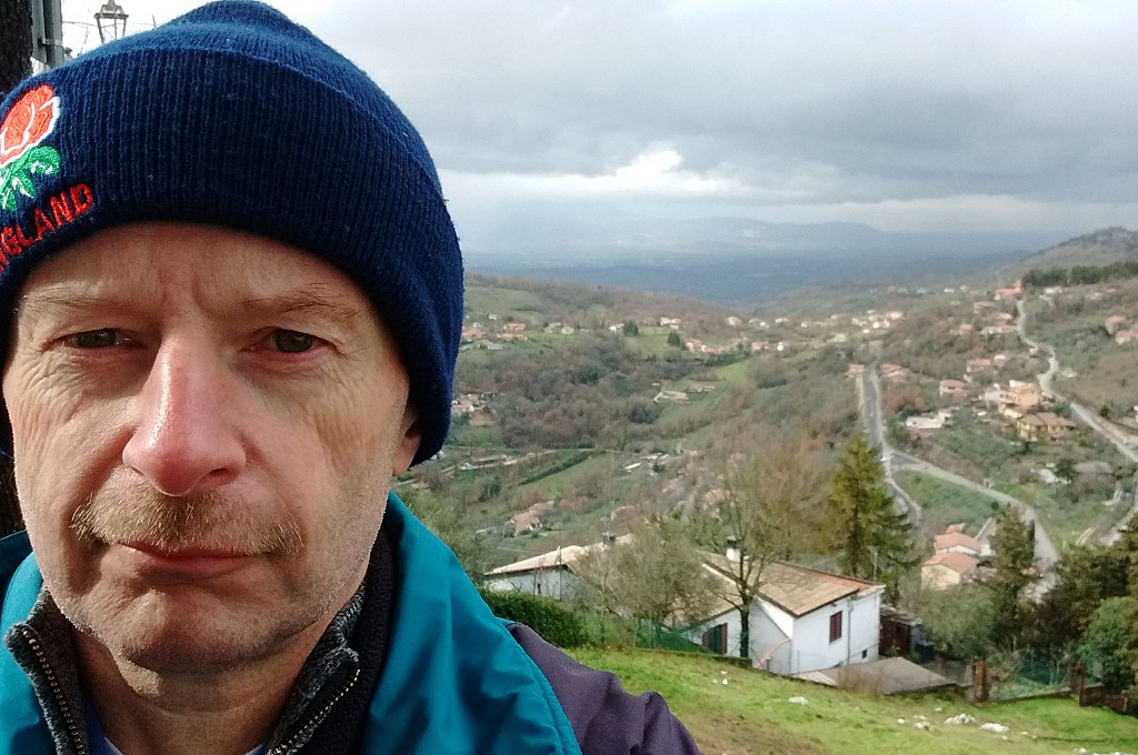 Me, looking a bit tired, with Italian countryside view behind